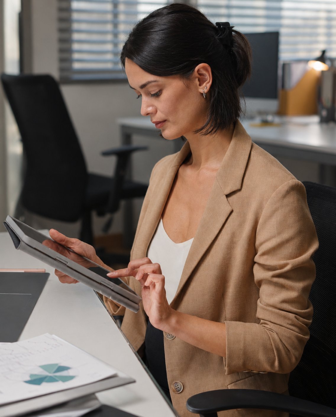 Woman in an office working on a tablet